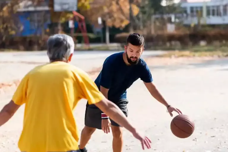 Father and son playing basketball in parks in Maryland