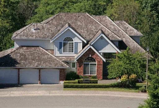 one of the cheapest roof materials, cedar shake shingles on modern house