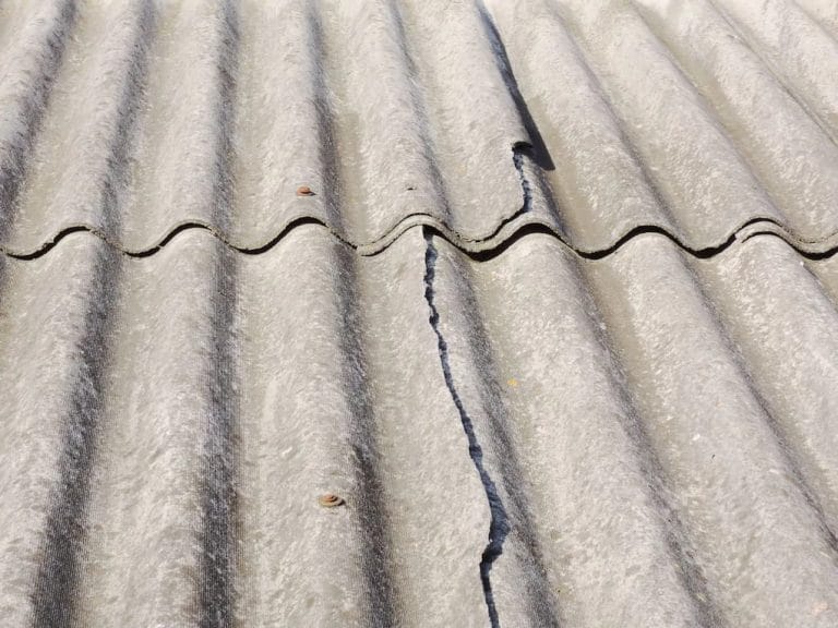 cracked tile in need of a tile roof replacement