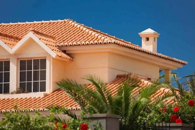 home with clay roof tiles; tile roof cost