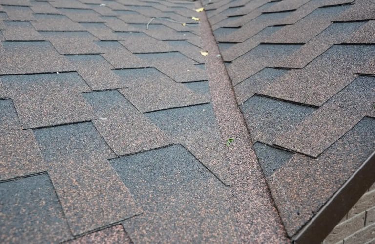 close up of asphalt shingle valley flashing on a roof