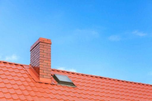 roof saddle on a clay tile roof