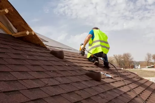 roofing companies in rockville putting the asphalt roofing (shingles) on the roof